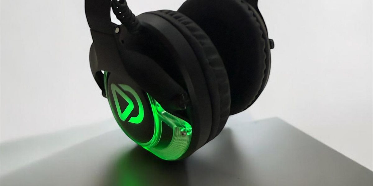 Dolly Digital CD-Pro headphones with a glowing green logo